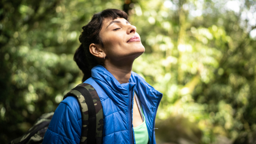 young-woman-breathing-pure-air-in-a-forest-stockpack-istock.jpg