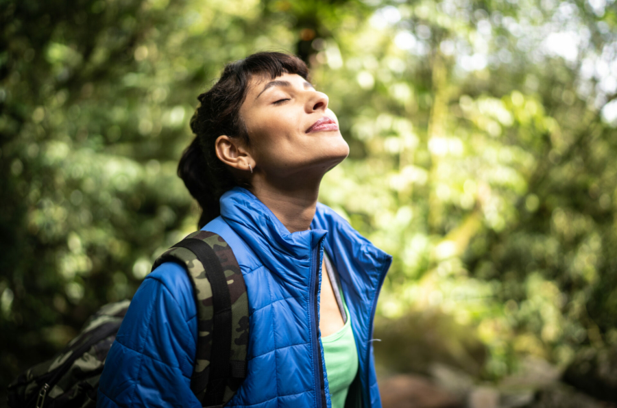 young-woman-breathing-pure-air-in-a-forest-stockpack-istock.jpg